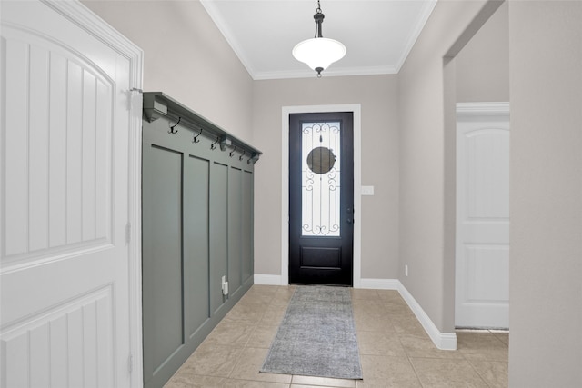 mudroom featuring crown molding, baseboards, and light tile patterned floors