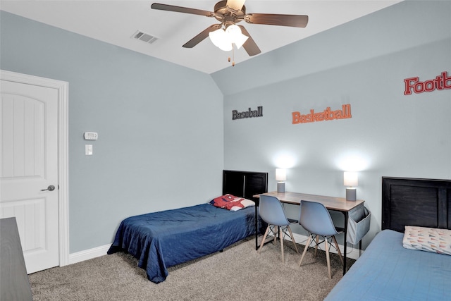 carpeted bedroom featuring vaulted ceiling, visible vents, baseboards, and a ceiling fan