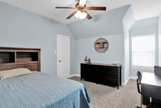 carpeted bedroom with lofted ceiling, baseboards, and a ceiling fan