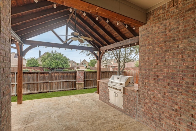 view of patio with a grill, a ceiling fan, fence, area for grilling, and a gazebo
