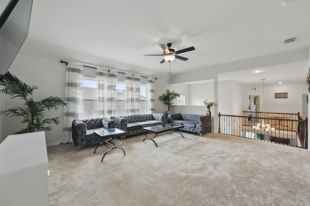carpeted living area with a ceiling fan and visible vents