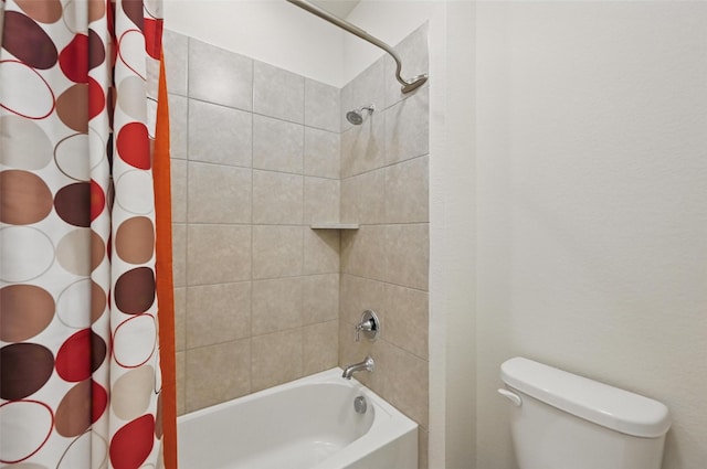bathroom featuring toilet and shower / bath combo