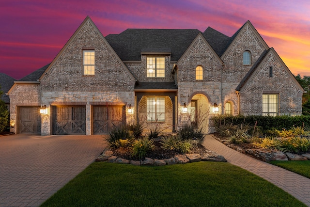 280 Gentry Dr, Prosper, TX 75078 - french country home with a yard, decorative driveway, brick siding, and stone siding