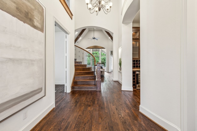 280 Gentry Dr, Prosper, TX 75078 - entrance foyer featuring stairs, wood finished floors, baseboards, a chandelier, and arched walkways