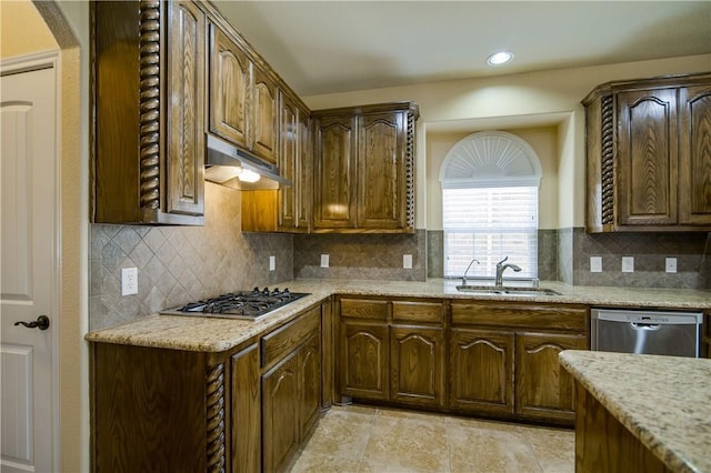 1290 Polo Heights Dr, Frisco, TX 75033 - kitchen featuring under cabinet range hood, appliances with stainless steel finishes, a sink, and light stone counters