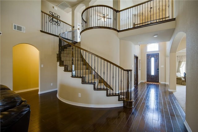 1290 Polo Heights Dr, Frisco, TX 75033 - entryway featuring arched walkways, visible vents, wood-type flooring, and a towering ceiling
