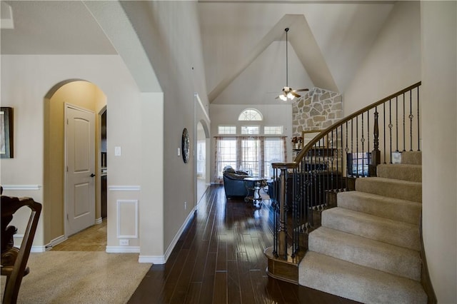 1290 Polo Heights Dr, Frisco, TX 75033 - entryway with arched walkways, high vaulted ceiling, a ceiling fan, wood finished floors, and stairway