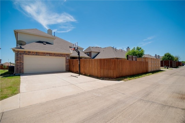 1290 Polo Heights Dr, Frisco, TX 75033 - view of property exterior with brick siding, a garage, fence, and concrete driveway