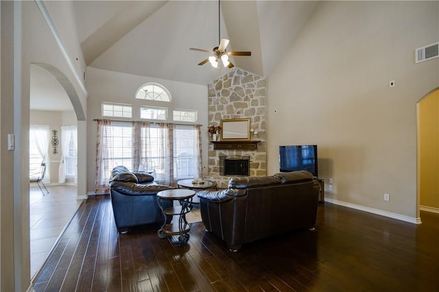 1290 Polo Heights Dr, Frisco, TX 75033 - living area with visible vents, a fireplace, ceiling fan, high vaulted ceiling, and arched walkways