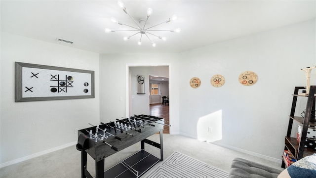 recreation room with visible vents, baseboards, a chandelier, and light colored carpet