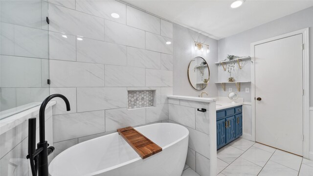 bathroom featuring vanity and a freestanding tub