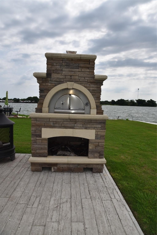 exterior details with an outdoor stone fireplace