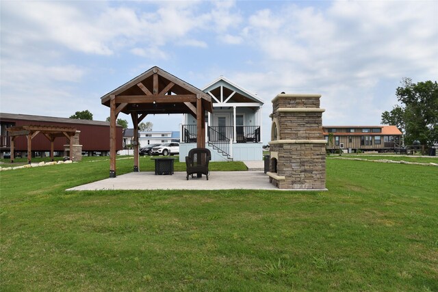 exterior space featuring a gazebo, a yard, a patio area, and stairway