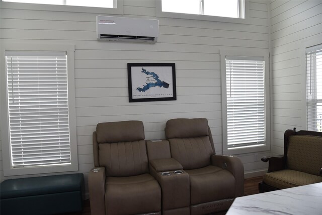 interior space with wooden walls and a wall mounted air conditioner