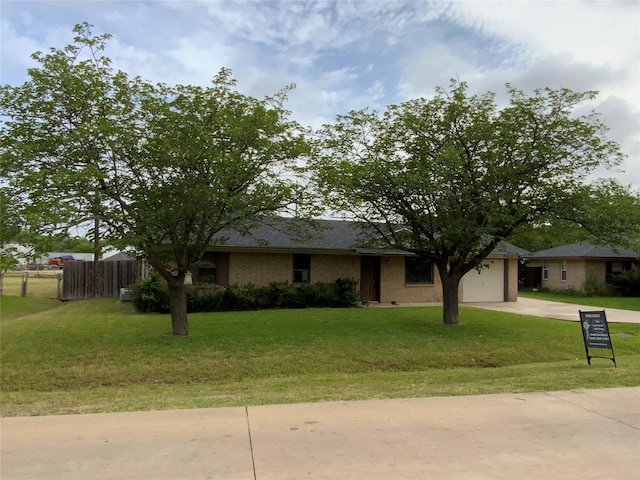 103 Jackilu St, Sanger, TX 76266 - view of front of home with concrete driveway and an attached garage