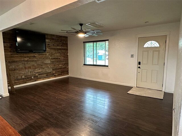 foyer entrance featuring a healthy amount of sunlight, baseboards, ceiling fan, and dark wood-style floors
