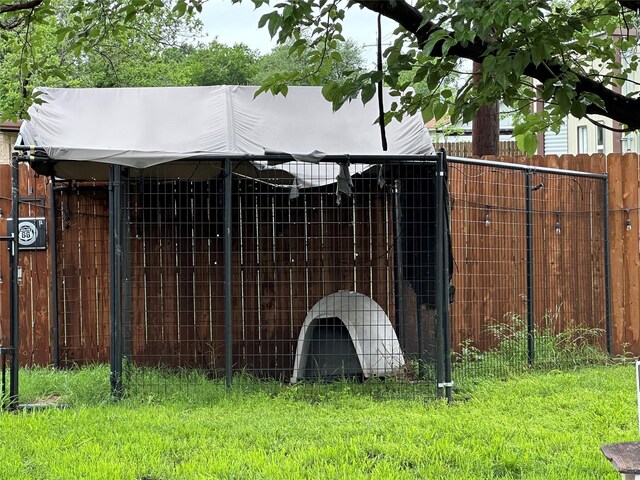 view of gate featuring fence