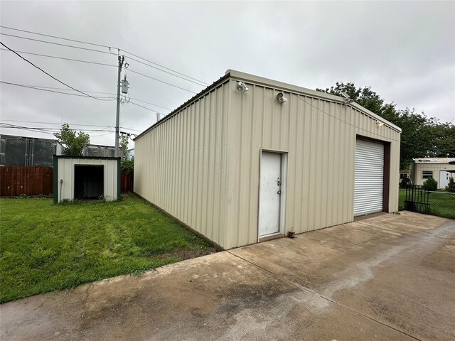 view of shed with fence