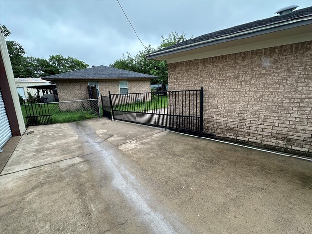 view of gate with fence