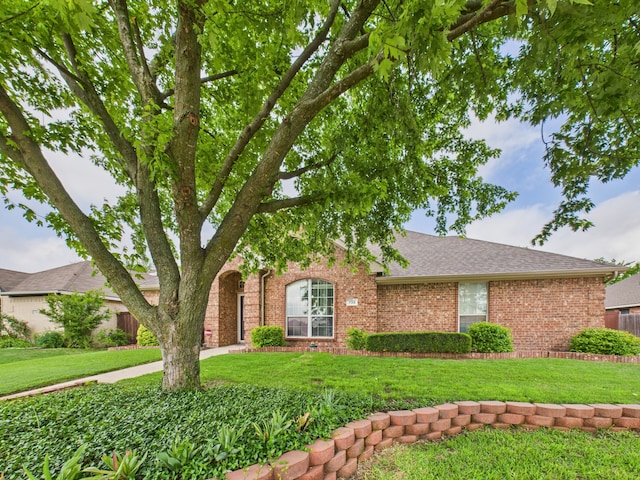 733 Willow Crest Dr, Midlothian, TX 76065 - view of front of house featuring a front lawn, brick siding, and roof with shingles
