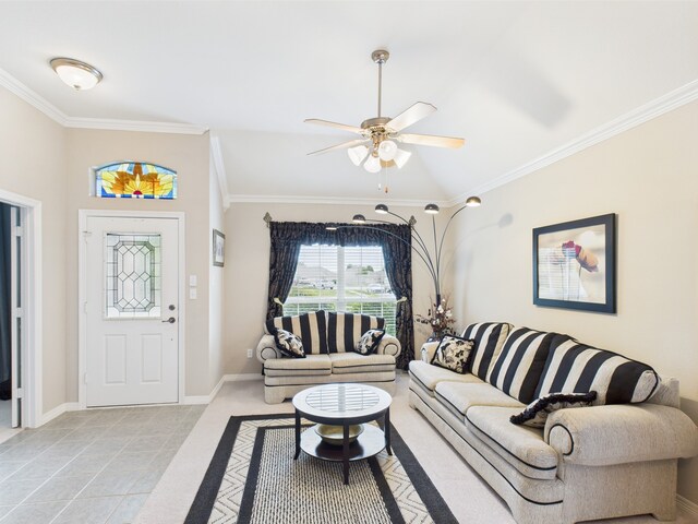 living room with baseboards, ornamental molding, a ceiling fan, and light tile patterned flooring