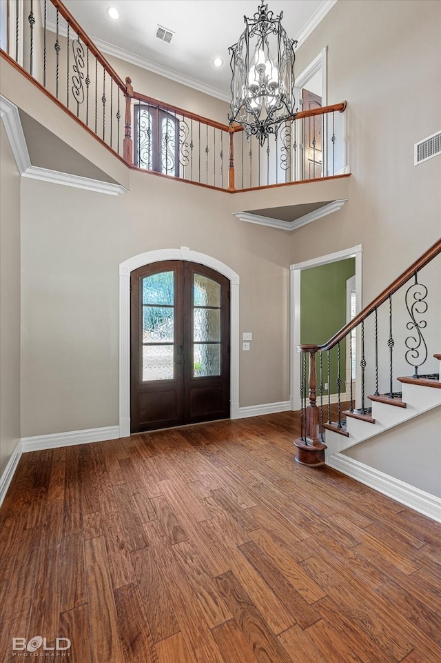 11 Chapel Creek Ln, Shreveport, LA 71106 - foyer with french doors, a chandelier, plenty of natural light, stairs, and ornamental molding
