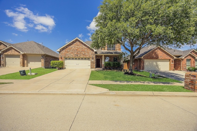 3949 Sunnygate Dr, Fort Worth, TX 76262 - view of front of home featuring brick siding, driveway, and a front yard
