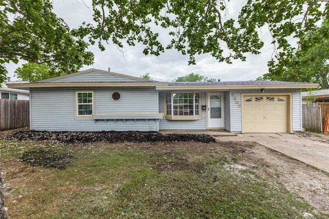 single story home with an attached garage, fence, and concrete driveway