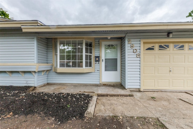 property entrance featuring a garage