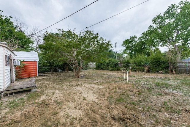 view of yard with fence and cooling unit