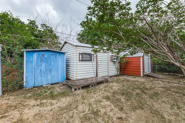 view of shed with fence