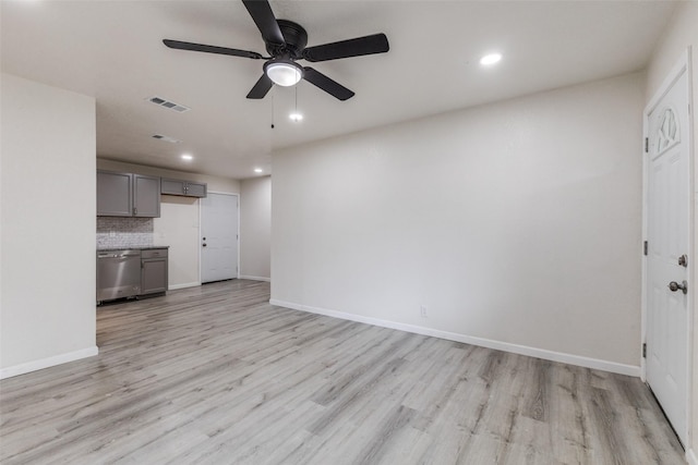 unfurnished living room featuring recessed lighting, light wood finished floors, and visible vents