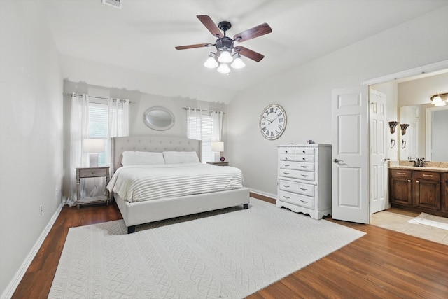 4610 Bluebird Ln, Mansfield, TX 76063 - bedroom with wood finished floors, baseboards, connected bathroom, ceiling fan, and lofted ceiling