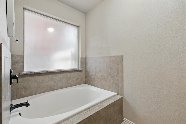 4610 Bluebird Ln, Mansfield, TX 76063 - full bathroom with a garden tub and a textured wall