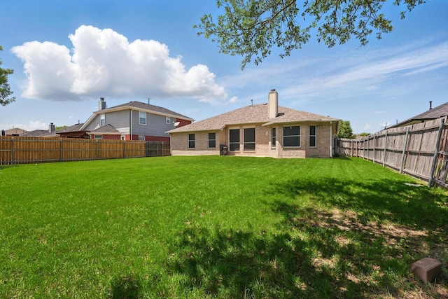 4610 Bluebird Ln, Mansfield, TX 76063 - back of house with brick siding and a chimney