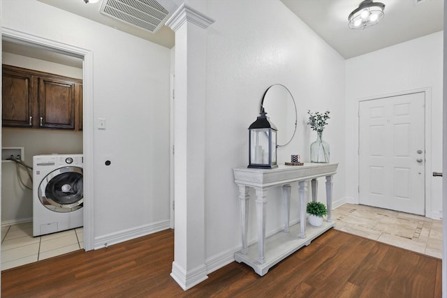4610 Bluebird Ln, Mansfield, TX 76063 - clothes washing area with washer / dryer, cabinet space, wood finished floors, and baseboards