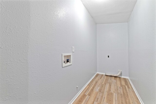 laundry room with laundry area, hookup for a washing machine, baseboards, light wood-type flooring, and hookup for an electric dryer