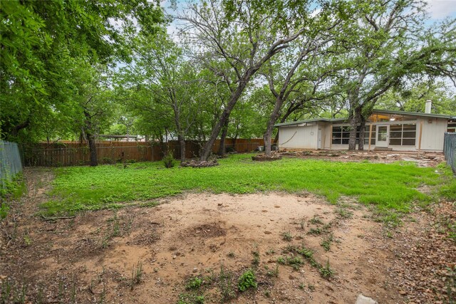 view of yard with a fenced backyard