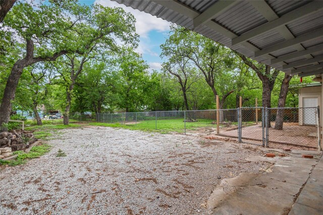 view of yard featuring fence and a gate