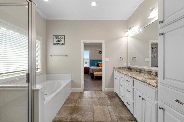 bathroom with a sink, double vanity, ensuite bathroom, ornamental molding, and a garden tub