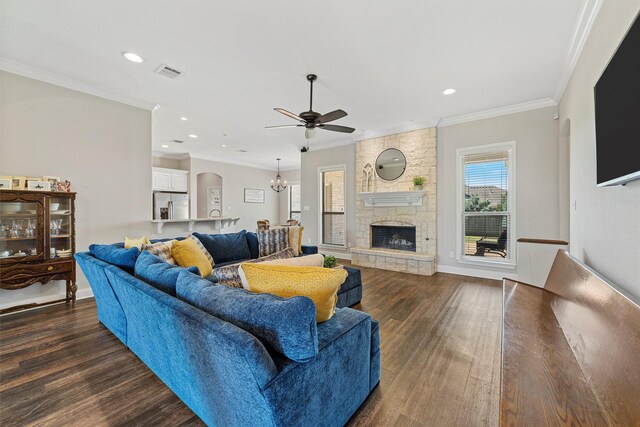 living area with a ceiling fan, a stone fireplace, visible vents, recessed lighting, and dark wood-type flooring