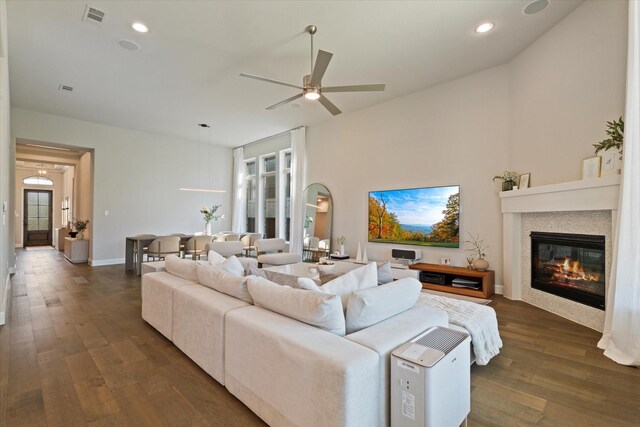 dining area featuring a healthy amount of sunlight, a ceiling fan, dark wood-type flooring, and visible vents