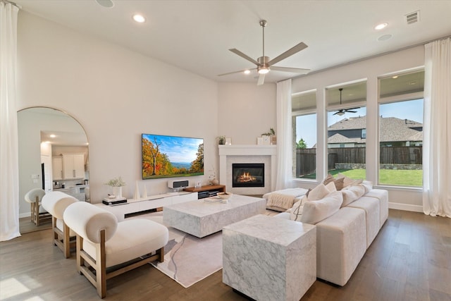 3320 Alexandra Ln, Celina, TX 75009 - living room featuring a ceiling fan, a glass covered fireplace, dark wood-style flooring, and recessed lighting