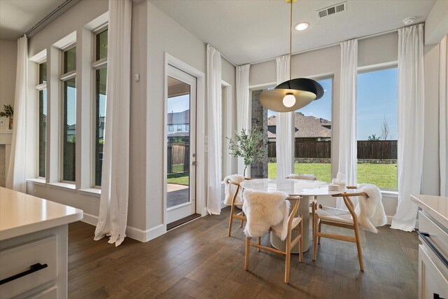 kitchen with backsplash, appliances with stainless steel finishes, a sink, dark wood-style floors, and custom range hood