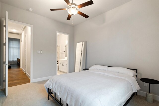 walk in closet featuring light colored carpet
