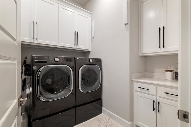 3320 Alexandra Ln, Celina, TX 75009 - laundry room featuring cabinet space, washing machine and dryer, marble finish flooring, and baseboards