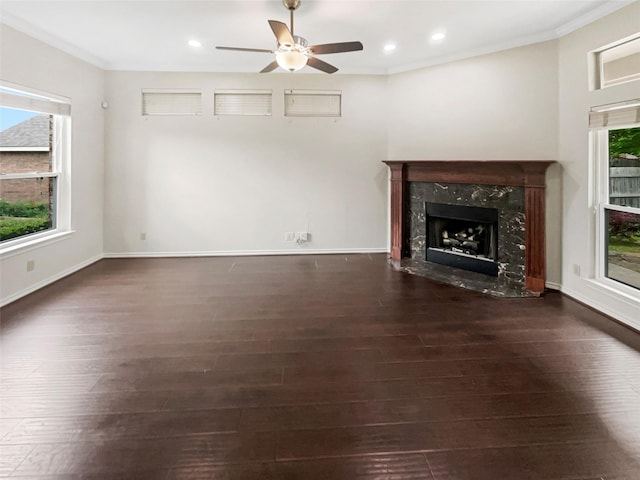 unfurnished living room with a ceiling fan, recessed lighting, wood finished floors, and a fireplace