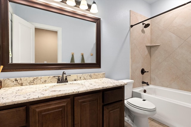 bathroom featuring vanity, bathtub / shower combination, and toilet