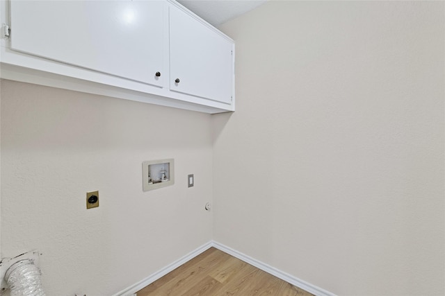laundry area featuring washer hookup, baseboards, hookup for a gas dryer, light wood-type flooring, and hookup for an electric dryer