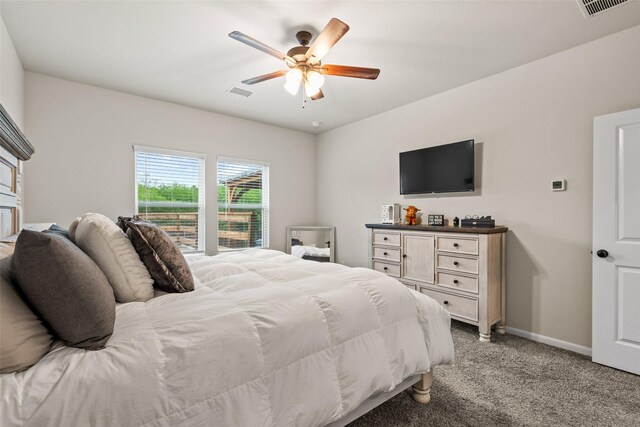 bedroom with visible vents, baseboards, ceiling fan, and light carpet
